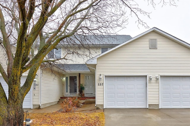 traditional-style house with driveway and a garage