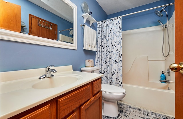 bathroom featuring vanity, toilet, and shower / bath combo with shower curtain