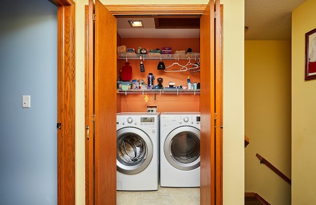 washroom featuring washer and dryer and laundry area