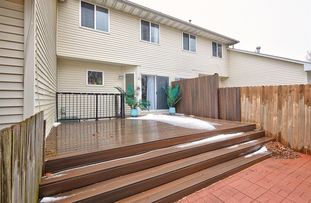 wooden terrace featuring fence