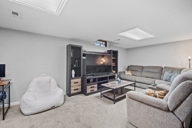 carpeted living room with visible vents and baseboards