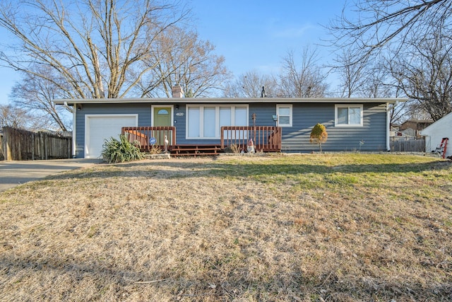 ranch-style home with a front yard, fence, a garage, and a chimney