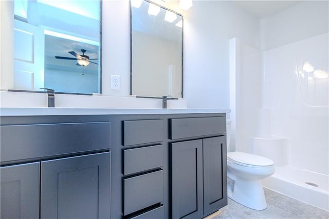 full bath featuring walk in shower, toilet, double vanity, a ceiling fan, and a sink