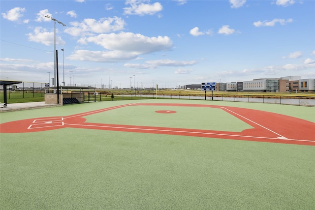 surrounding community featuring community basketball court and fence