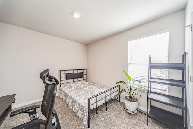 bedroom featuring baseboards and carpet floors