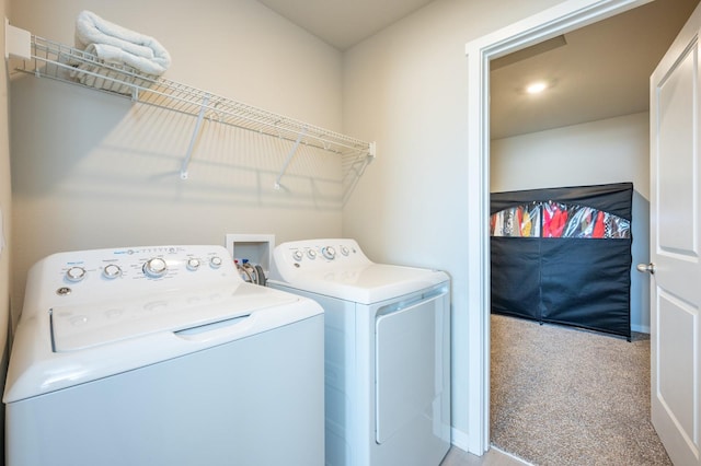 washroom with washer and dryer, laundry area, baseboards, and carpet floors