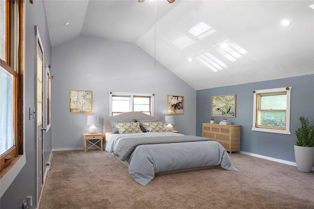 carpeted bedroom with baseboards and high vaulted ceiling