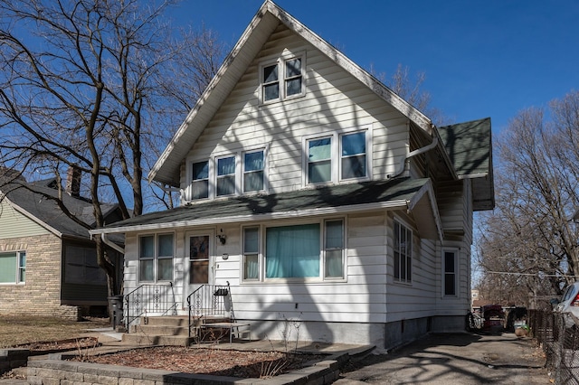 view of front of property with a shingled roof