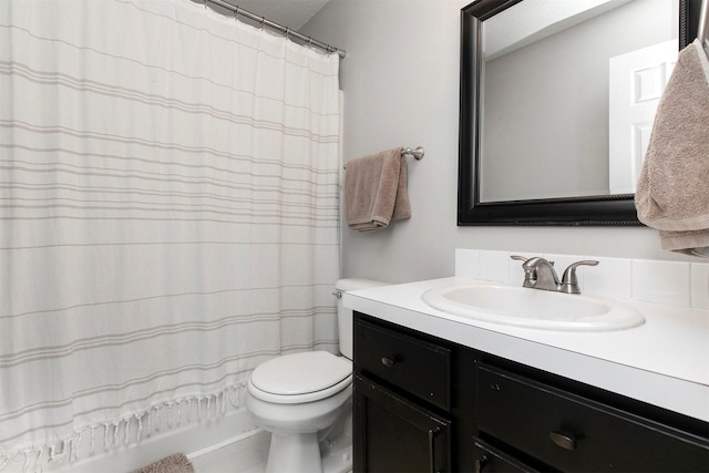 bathroom with vanity, toilet, and a shower with curtain