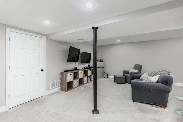 carpeted living area featuring recessed lighting, baseboards, and visible vents