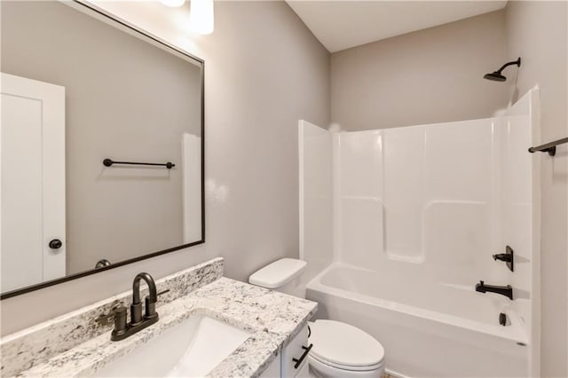 full bathroom with toilet, vanity, and washtub / shower combination