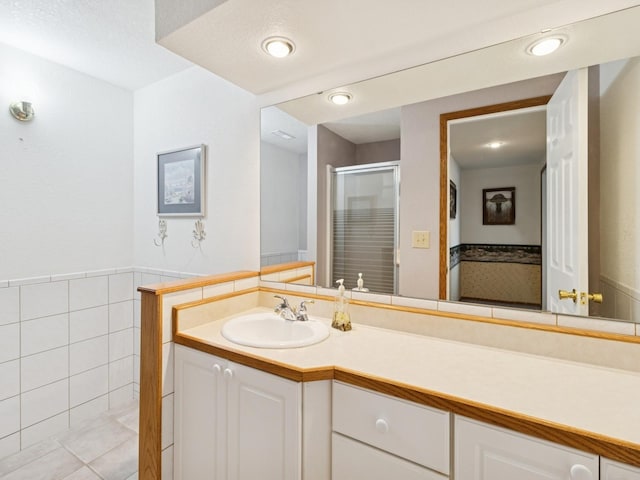 bathroom featuring vanity and a stall shower