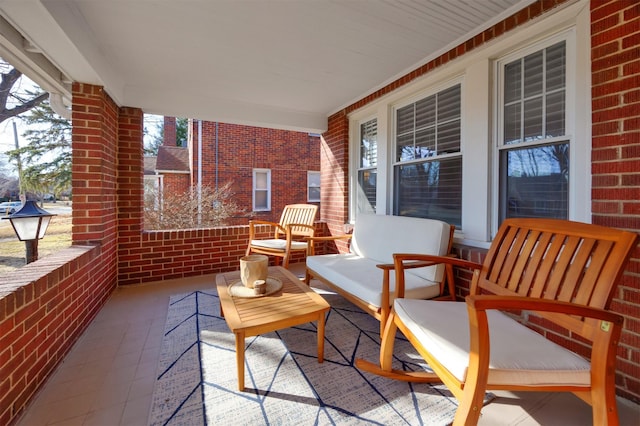 view of patio featuring a porch