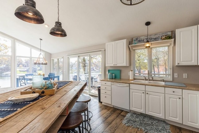 kitchen featuring a sink, white cabinets, dishwasher, dark wood-style flooring, and hanging light fixtures