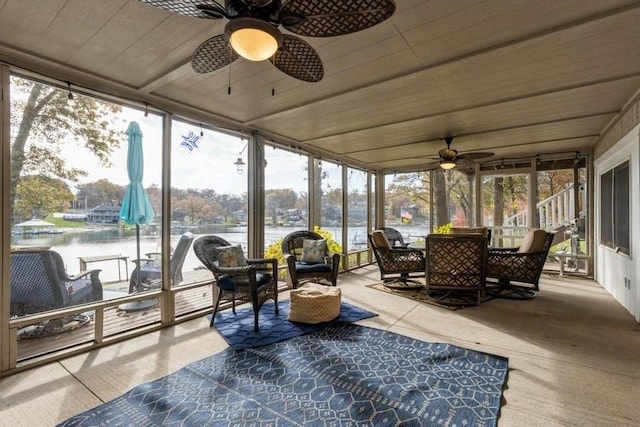 sunroom / solarium featuring wood ceiling and ceiling fan