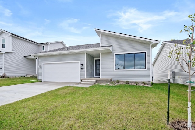 view of front of house featuring concrete driveway, a garage, and a front lawn