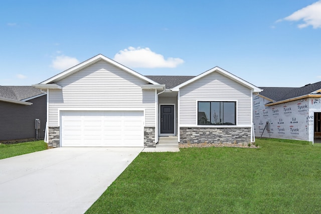 1811 Tuscany Dr SE, Altoona, IA 50009 - view of front of home featuring stone siding, a garage, a front yard, and entry steps