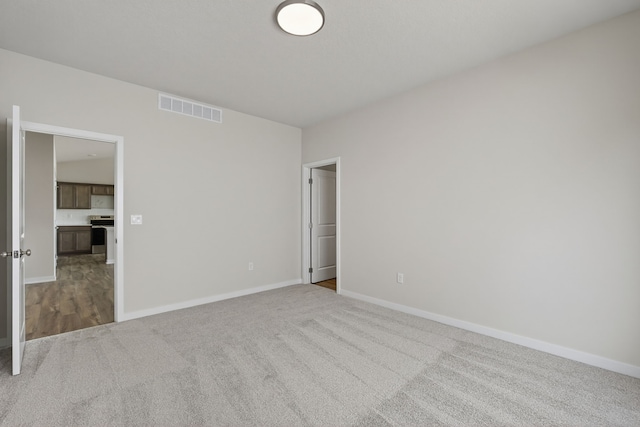 1811 Tuscany Dr SE, Altoona, IA 50009 - unfurnished bedroom featuring carpet and baseboards