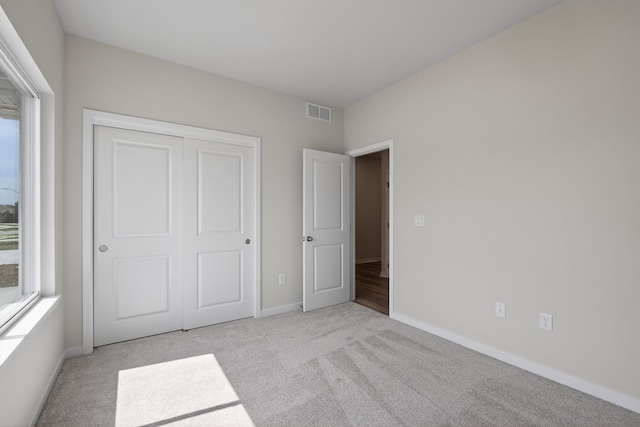1811 Tuscany Dr SE, Altoona, IA 50009 - unfurnished bedroom featuring light carpet and a closet