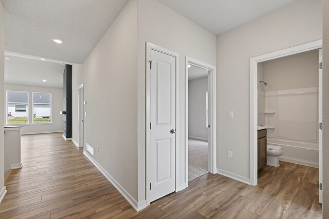 1811 Tuscany Dr SE, Altoona, IA 50009 - hall featuring wood finished floors and recessed lighting