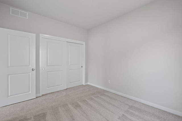 1811 Tuscany Dr SE, Altoona, IA 50009 - unfurnished bedroom featuring carpet floors and a closet