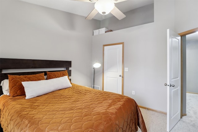 carpeted bedroom featuring visible vents, a ceiling fan, and baseboards