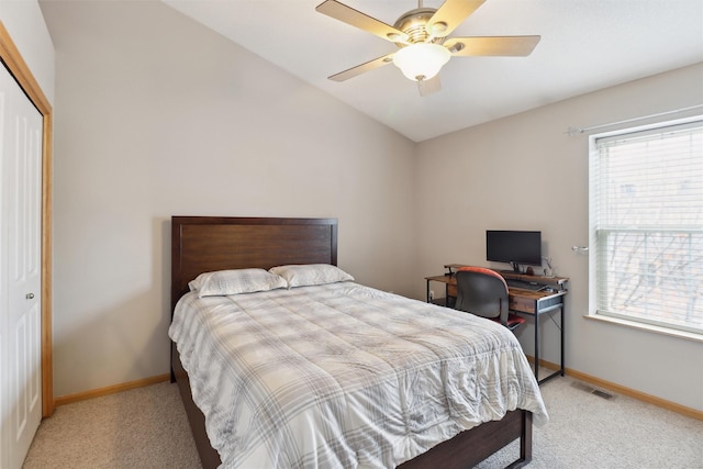 bedroom featuring visible vents, baseboards, a closet, and light carpet