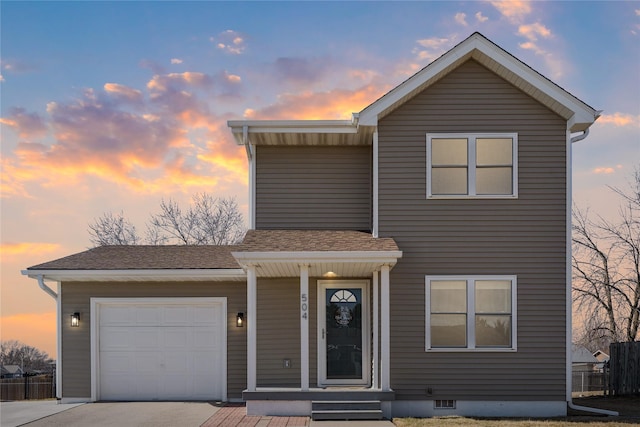 traditional-style home featuring driveway, roof with shingles, and an attached garage