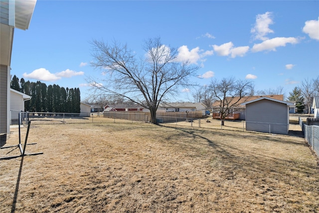 view of yard featuring a residential view and fence