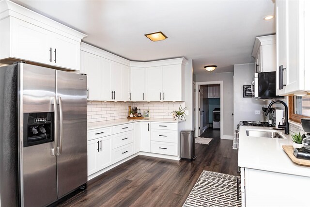 kitchen with dark wood-type flooring, light countertops, decorative backsplash, appliances with stainless steel finishes, and white cabinetry