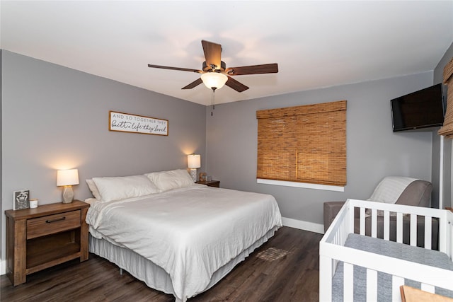 bedroom featuring wood finished floors, baseboards, and ceiling fan