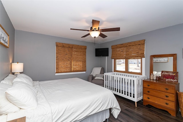 bedroom with a ceiling fan and wood finished floors