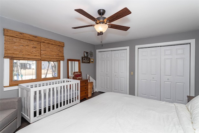 bedroom featuring two closets and a ceiling fan