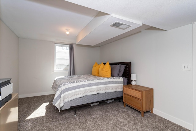 carpeted bedroom with visible vents and baseboards