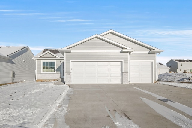 single story home with an attached garage and driveway