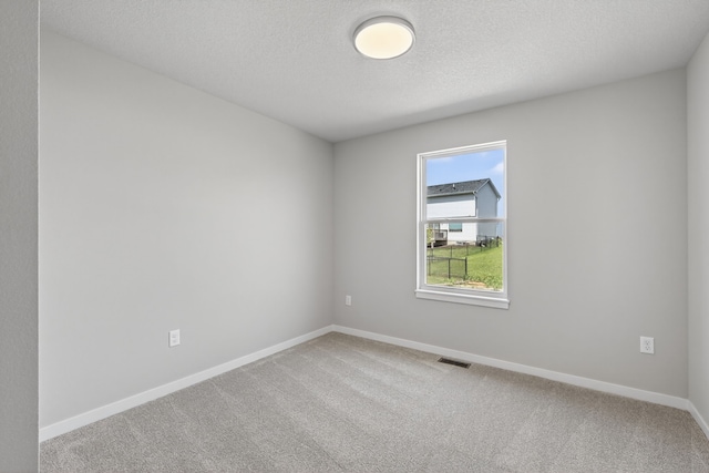 1803 Tuscany Dr SE, Altoona, IA 50009 - spare room featuring carpet floors and a textured ceiling
