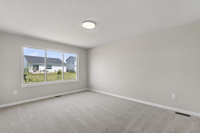 1803 Tuscany Dr SE, Altoona, IA 50009 - carpeted empty room featuring a textured ceiling and baseboards