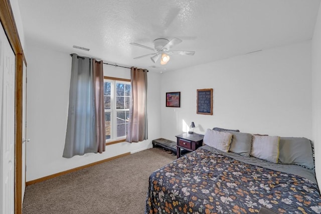 bedroom featuring a ceiling fan, baseboards, visible vents, a textured ceiling, and carpet flooring