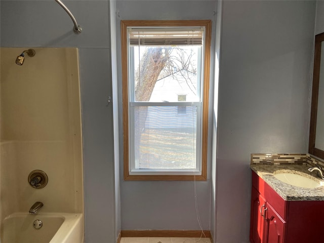 bathroom with vanity and bathing tub / shower combination