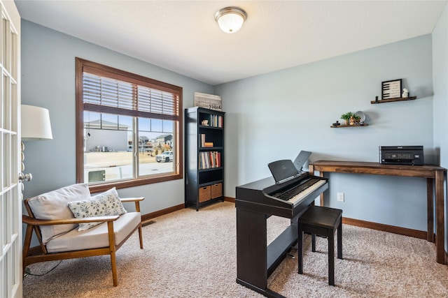 carpeted office featuring visible vents and baseboards