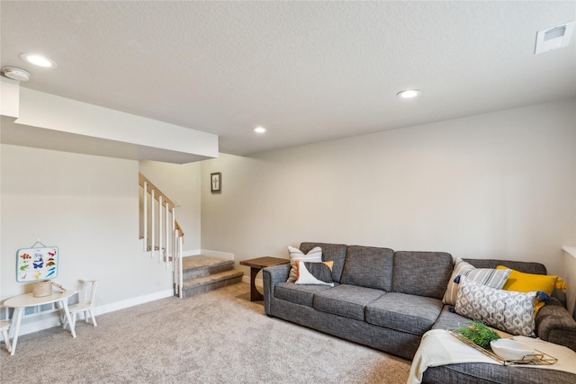 living room featuring stairway, visible vents, baseboards, recessed lighting, and light colored carpet