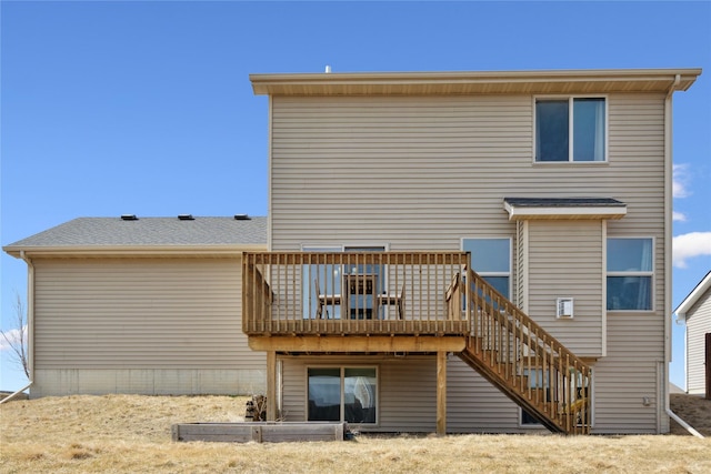 back of house with stairway and a wooden deck