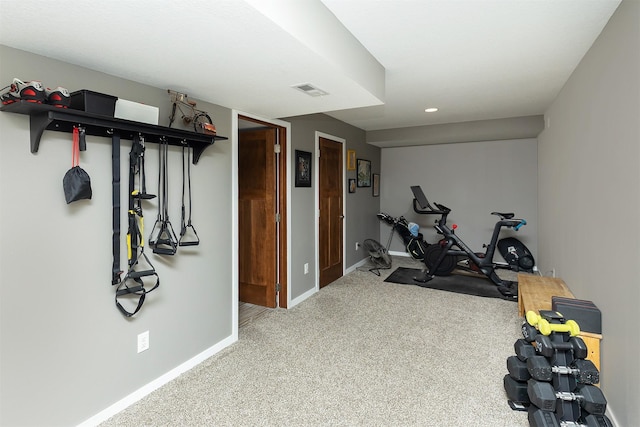 exercise area featuring recessed lighting, visible vents, baseboards, and carpet floors