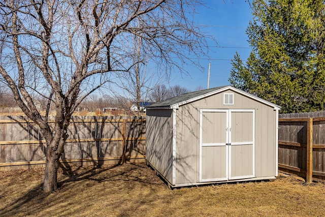 view of shed featuring a fenced backyard