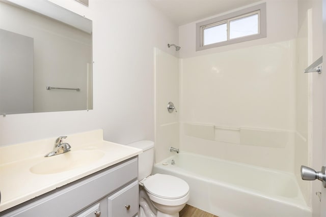 full bath featuring vanity, toilet, and washtub / shower combination