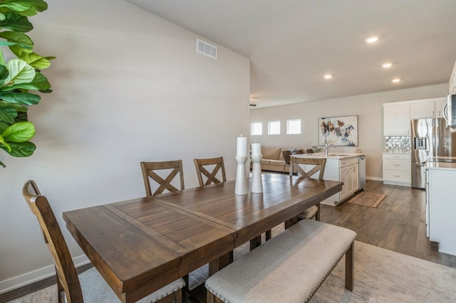 dining area featuring visible vents, recessed lighting, baseboards, and dark wood-style flooring