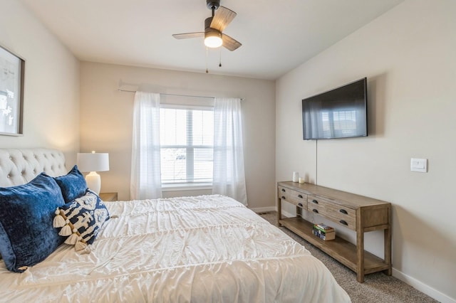 bedroom featuring ceiling fan, baseboards, and carpet