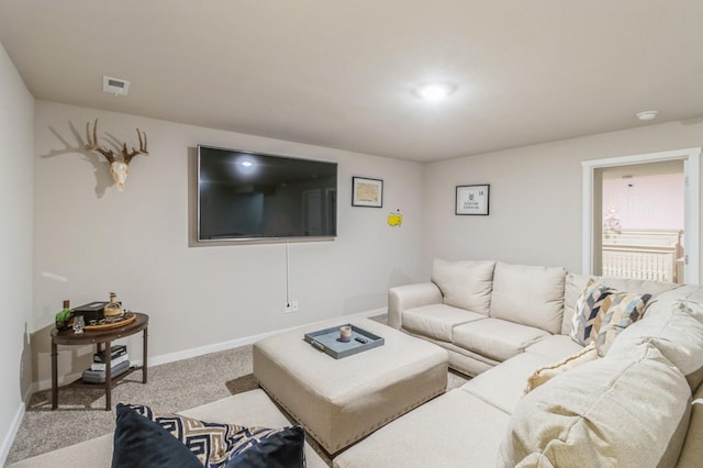 living area with carpet flooring, visible vents, and baseboards