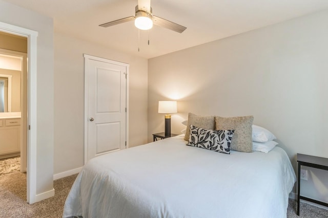 carpeted bedroom with a ceiling fan and baseboards