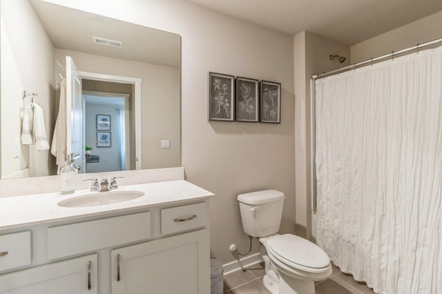 2806 SW Prairie Trail Pkwy, Ankeny, IA 50023 - bathroom featuring toilet, visible vents, tile patterned flooring, and vanity